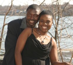 A NY Christian couple hug tightly and laugh together by the water in April