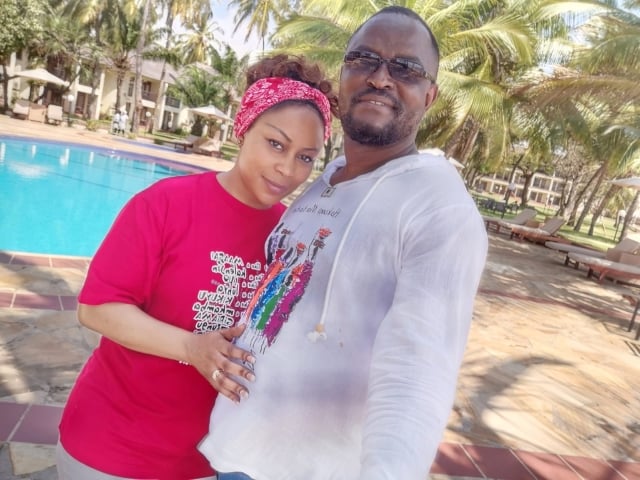 Beautiful Christian couple in front of pool at resort in Tanzania