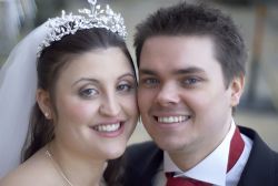 Beautiful Christian couple from England smile cheek to cheek after marrying