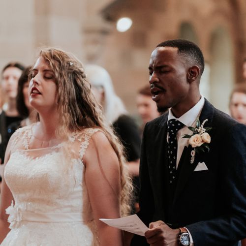 Christian couple singing praises at their wedding