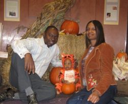 Christian couple still in love pose at Halloween with their little boy