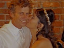 A joyful Christian man receives a kiss on the cheek from his loving wife