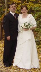 Happy Christians from Ohio and Romania stand proudly together for their Autumn wedding