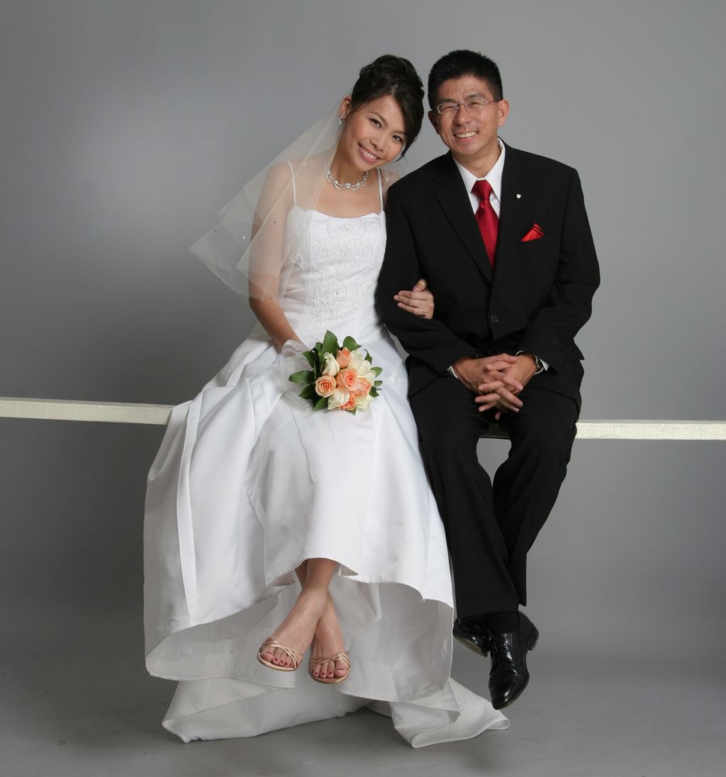 A new bride and groom look very comfortable together. American single meets woman in Malaysia
