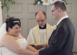 Happy Christians full of laughter as they exchange vows